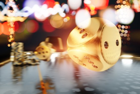 golden dice rolling on game night