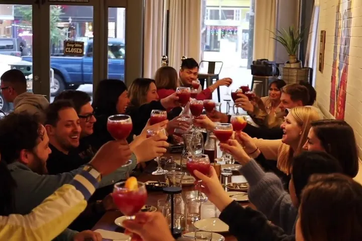 Guests toasting with sangria at a Mission District Food Tour tasting