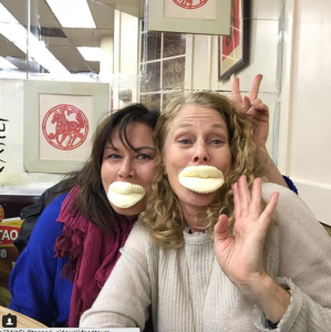 eating buns on a Sidewalk Team Building Food Tour of SF