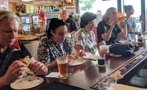 A group of travelers enjoying a walking food tour of NYC