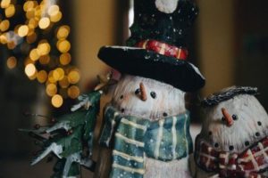 an ornamental snowman and christmas tree