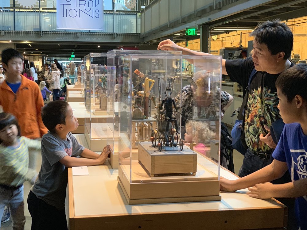 kids exploring an exhibit at a science museum