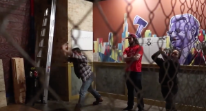 two people throwing axes