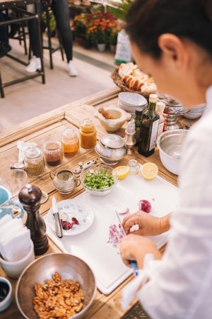 a chef preparing food at a demonstration table