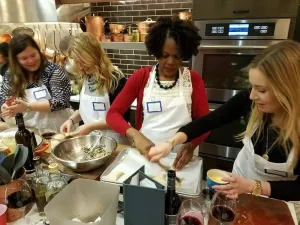a group of people preparing food in a restaurant