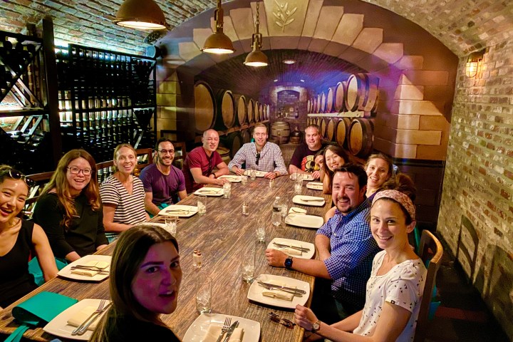 a group of people sitting at a table