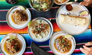 a bowl filled with different types of food on a table