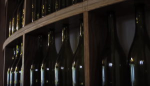 a bottle and a glass of wine