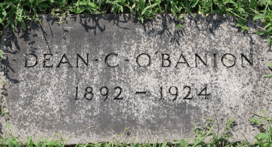 The front of a ground headstone that reads "Dean C. O'Banion. 1892 - 1924"