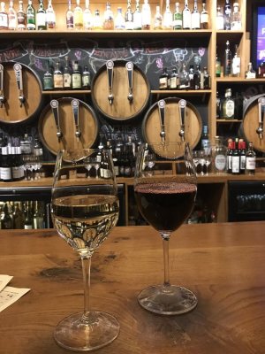 a bar in a winery with barrel taps