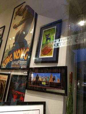 a store front with framed movie posters