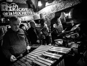a black and white photo of musician playing