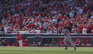 a crowd of people watching a baseball game