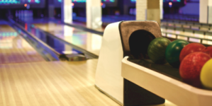 bowling balls with bowling lanes in the background