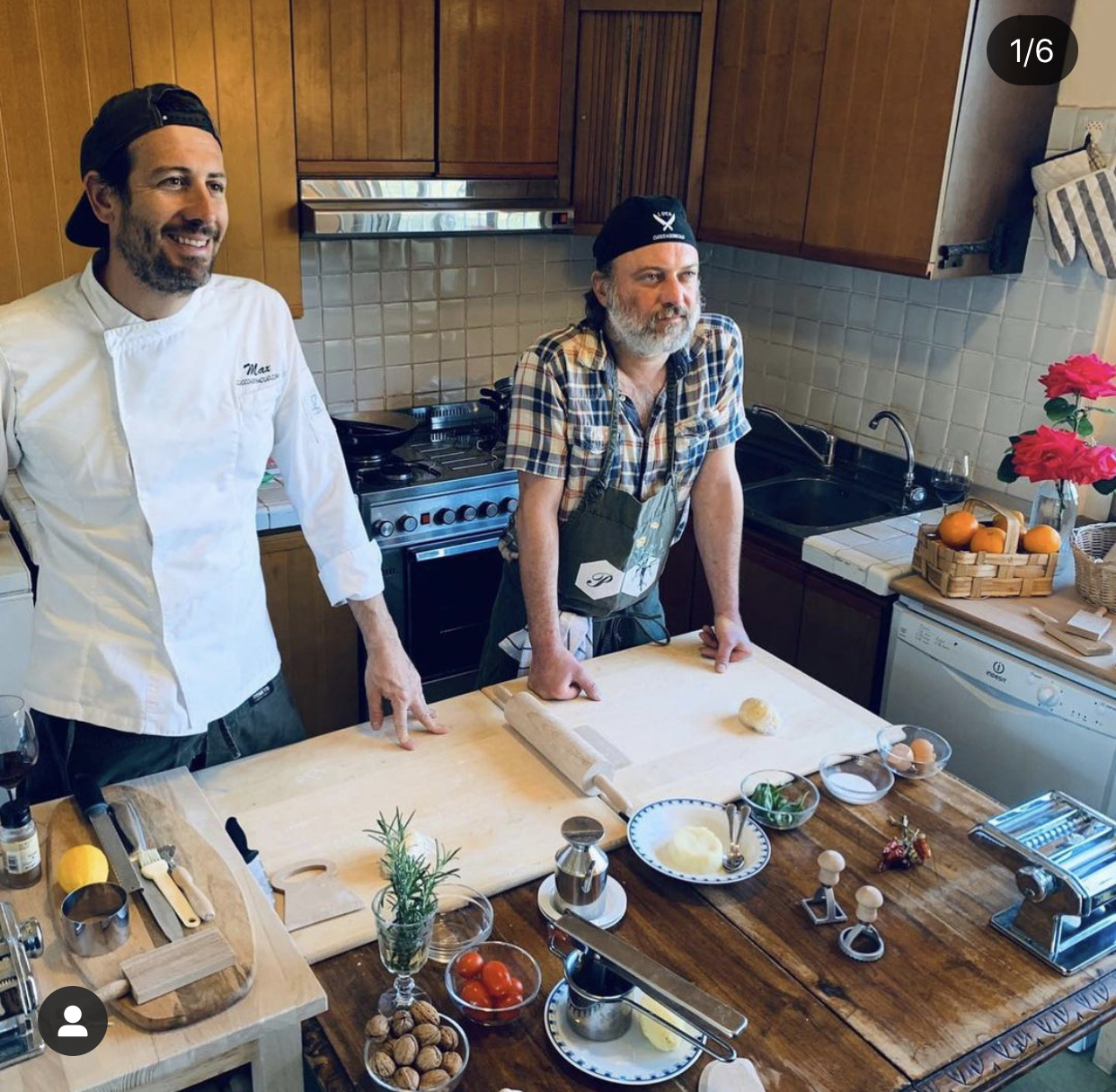 a group of people standing in a kitchen preparing food