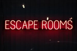 a sign lit up at night