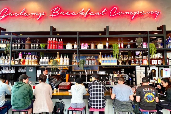 a group of people standing in front of a store