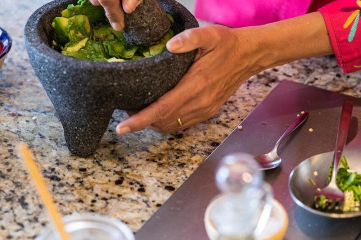 a person preparing food in a bowl