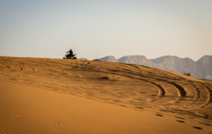 an ATV cruising around the dessert