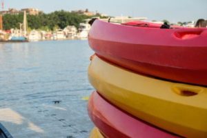a stack of tandem kayaks