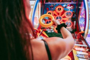 someone playing an arcade toss game