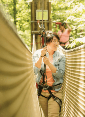 Girl on aerial obstacle course