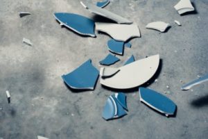 a broken plate on the ground