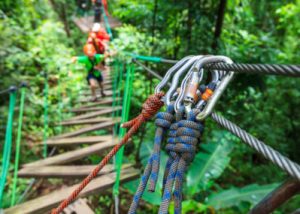 a close up of the ropes and clasps on a ropes course