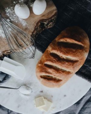 bread and flour and eggs on a kitchen prep table