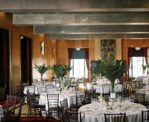 a dining room table in front of windows