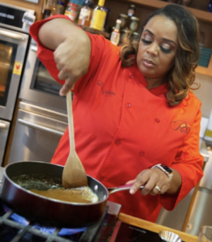 a person cooking food in a kitchen