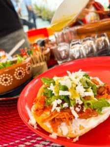 a plate of Mexican food on a table