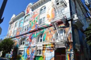 a building with beautiful, colorful murals of women in san francisco