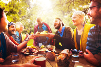 A group of people having a picnic in a park
