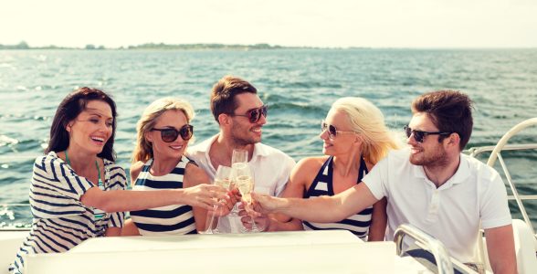 Five friends making a champagne toast on a riverboat tour