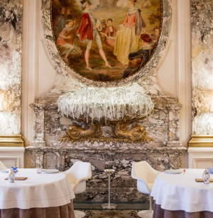 beautiful royal dining room with ornate art and marble