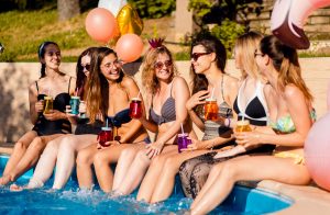 Group of girls at a bachelorette party in the pool
