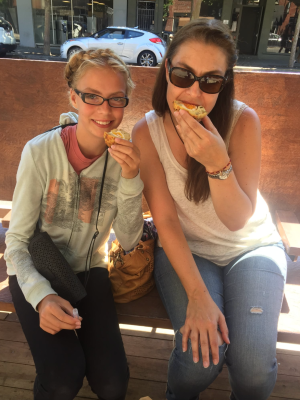 a couple of people that are sitting down eating