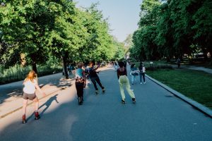A group rollerskating down a scenic road together
