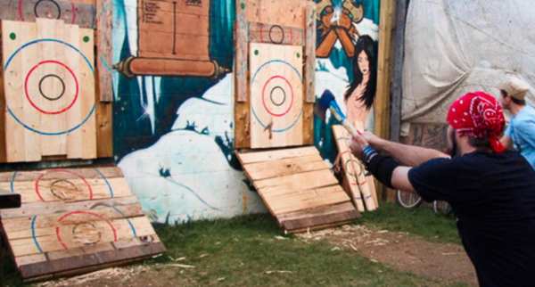 a person throwing an axe at a target