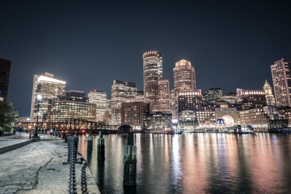 a body of water with a BOSTON skyline in the background