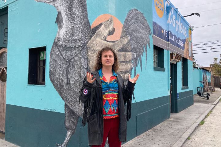 a person standing in front of a statue