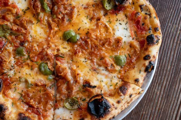 a close up of a plate of pizza