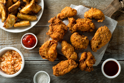 a bunch of fried food sitting on a table