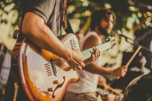a man holding a guitar