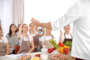 a chef teaching students how to cook