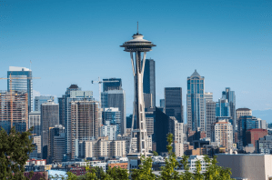 a large body of water with Space Needle in the background