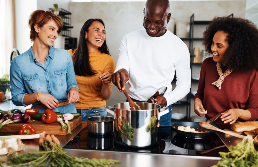 a group of people preparing food in a kitchen