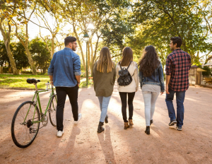 a group of people riding on the back of a bicycle