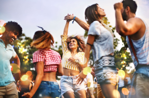 a group of people standing around each other